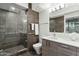 Bathroom with modern vanity, shower, and dark tile at 7120 E Kierland Blvd # 218, Scottsdale, AZ 85254