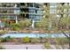 Tranquil courtyard with a reflecting pool and lush landscaping at 7120 E Kierland Blvd # 218, Scottsdale, AZ 85254