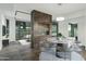 Open dining area with modern fireplace and large windows at 7120 E Kierland Blvd # 218, Scottsdale, AZ 85254