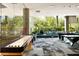 Community game room with shuffleboard and views to outdoor patio at 7120 E Kierland Blvd # 218, Scottsdale, AZ 85254