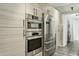 Modern kitchen with stainless steel appliances and light wood cabinets at 7120 E Kierland Blvd # 218, Scottsdale, AZ 85254