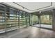 Open living area with floor-to-ceiling windows and access to a balcony at 7120 E Kierland Blvd # 218, Scottsdale, AZ 85254