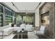 Spacious living room featuring a sectional sofa and access to a balcony at 7120 E Kierland Blvd # 218, Scottsdale, AZ 85254