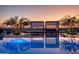 Resort-style pool with cabanas offering scenic sunset views at 7120 E Kierland Blvd # 218, Scottsdale, AZ 85254