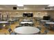 Large community room with tables and chairs for events at 7750 E Broadway Rd # 156, Mesa, AZ 85208