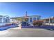Mobile home with covered porch and American flag at 7750 E Broadway Rd # 156, Mesa, AZ 85208
