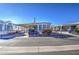 Mobile home with covered porch and American flag at 7750 E Broadway Rd # 156, Mesa, AZ 85208