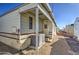 Rear view of mobile home showing AC unit and steps at 7750 E Broadway Rd # 156, Mesa, AZ 85208