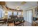 Living room with gray couch, wood floors, and patio access at 7750 E Broadway Rd # 156, Mesa, AZ 85208