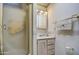 Bathroom features a shower, vanity, and linen storage at 7750 E Broadway Rd # 495, Mesa, AZ 85208