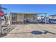 Mobile home with covered patio and parking at 7750 E Broadway Rd # 495, Mesa, AZ 85208