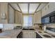 Cozy kitchen with light wood cabinets and modern appliances at 7750 E Broadway Rd # 495, Mesa, AZ 85208