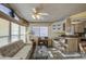 Living room features a sofa, coffee table, and built-in desk at 7750 E Broadway Rd # 495, Mesa, AZ 85208