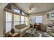 Sunlit living room boasts a comfy couch and large windows at 7750 E Broadway Rd # 495, Mesa, AZ 85208