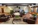 Community clubhouse lobby with leather furniture and fireplace at 7750 E Broadway Rd # 495, Mesa, AZ 85208