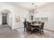 Elegant dining room with wood table and modern chandelier at 9439 E Trailside Vw, Scottsdale, AZ 85255