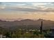 Stunning aerial view of property showcasing city and mountain views at 11098 E Whistling Wind Way, Scottsdale, AZ 85255