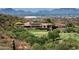 Luxury estate home nestled on a golf course with mountain backdrop at 11098 E Whistling Wind Way, Scottsdale, AZ 85255