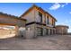 Modern home exterior with three-car garage at 11098 E Whistling Wind Way # 1851, Scottsdale, AZ 85255