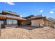 Modern home exterior with stone and wood accents at 11098 E Whistling Wind Way # 1851, Scottsdale, AZ 85255