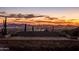 Stunning sunset view over city lights and mountains at 11098 E Whistling Wind Way, Scottsdale, AZ 85255