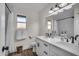 Updated bathroom with double vanity and modern fixtures at 1142 E Westchester Dr, Tempe, AZ 85283