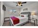 Bright bedroom with a queen bed and ceiling fan at 1142 E Westchester Dr, Tempe, AZ 85283