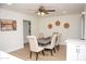 Bright dining room with a six-chair table and ceiling fan at 1142 E Westchester Dr, Tempe, AZ 85283