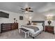 King-size bed, dresser, and ceiling fan in main bedroom at 1142 E Westchester Dr, Tempe, AZ 85283