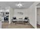 Cozy sitting area with two armchairs and a glass-top coffee table at 1142 E Westchester Dr, Tempe, AZ 85283