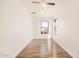 Simple bedroom with hardwood floors and ceiling fan at 11514 W Charter Oak Rd, El Mirage, AZ 85335