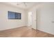 Bright bedroom with wood floors and closet at 11514 W Charter Oak Rd, El Mirage, AZ 85335