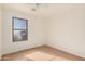 Bright bedroom with hardwood floors and large window at 11514 W Charter Oak Rd, El Mirage, AZ 85335