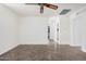 Bright bedroom with tile flooring and access to bathroom at 11514 W Charter Oak Rd, El Mirage, AZ 85335