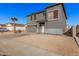 Two-story house with gray siding, attached garage, and landscaping at 11514 W Charter Oak Rd, El Mirage, AZ 85335