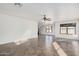 Bright living room with tile flooring and ceiling fan at 11514 W Charter Oak Rd, El Mirage, AZ 85335