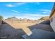 Large backyard with gravel and block wall at 11782 W Columbine Dr, El Mirage, AZ 85335