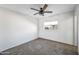 Bedroom with ceiling fan and carpet flooring at 11782 W Columbine Dr, El Mirage, AZ 85335