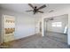 Bedroom with mirrored closet and attached bathroom at 11782 W Columbine Dr, El Mirage, AZ 85335