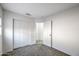 Well lit bedroom with closet and carpet flooring at 11782 W Columbine Dr, El Mirage, AZ 85335