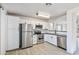 Modern kitchen featuring stainless steel appliances and white shaker cabinets at 11782 W Columbine Dr, El Mirage, AZ 85335