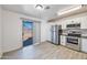 Modern kitchen with stainless steel appliances and white cabinets at 11782 W Columbine Dr, El Mirage, AZ 85335