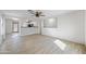 Bright and airy living room with wood-look tile flooring and ceiling fan at 11782 W Columbine Dr, El Mirage, AZ 85335