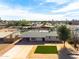 Aerial view of a single-story house with a green lawn at 1209 E Marigold Ln, Tempe, AZ 85288