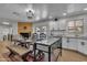 Farmhouse dining area with a fireplace and view of the kitchen and pool at 1209 E Marigold Ln, Tempe, AZ 85288