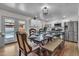 Modern kitchen with white cabinets, stainless steel appliances, and a farmhouse table at 1209 E Marigold Ln, Tempe, AZ 85288