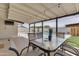 Covered patio with dining table and pool view at 1209 E Marigold Ln, Tempe, AZ 85288