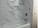 Updated bathroom with new bathtub and marble-look tile at 13013 N 19Th Pl, Phoenix, AZ 85022