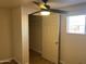 Bedroom with ceiling fan, closet, and wood-look floors at 13013 N 19Th Pl, Phoenix, AZ 85022