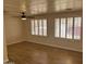 Living room with wood-look flooring and ceiling fan at 13013 N 19Th Pl, Phoenix, AZ 85022